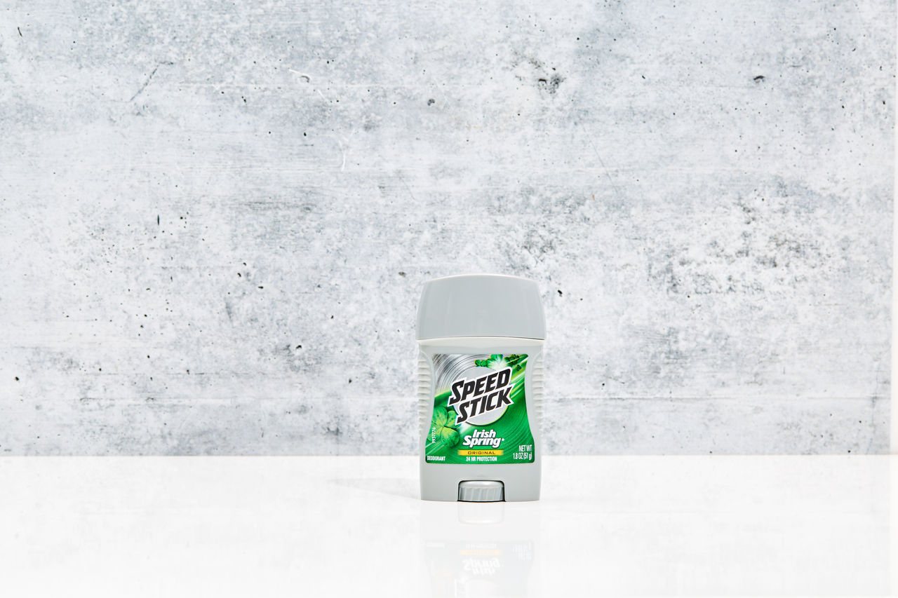 Speed Stick deodorant sticks in fresh green scent on marble surface.